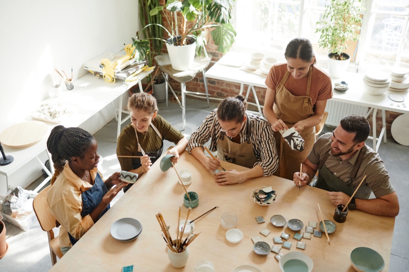 People Creating Pottery in Studio Top View